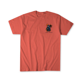 The Always Deadly Tee by Born United Private Label is a coral t-shirt with a left-chest graphic of a blue skeleton, palm tree, orange sun, and "DECKS UNITED" black text—adding an "Always Deadly" flair to your style.
