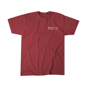 A classic red Youth America First t-shirt from Born United Private Label, featuring crisp white "America 1st Born United" lettering on the left chest—a subtle tribute to George Washington’s vision for a united and harmonious nation.
