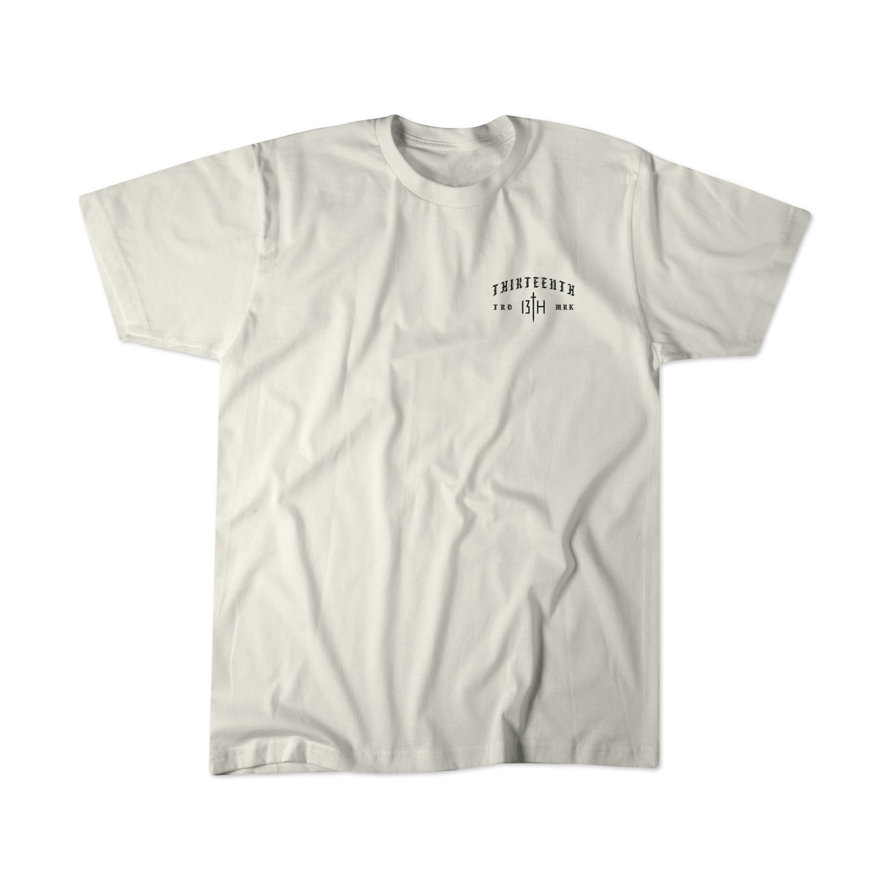 A premium plain white tee from 13th, the Be Strong Premium Tee features minimalist black text and numbers printed on the left chest that read “Thirteenth” and “13th,” along with a short line of smaller text subtly inspired by Joshua 1:9.