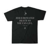 The "Live Like Charlie" tee by Born United Private Label features "JESUS DEFEATED DEATH SO YOU CAN LIVE. - CHARLIE KIRK" in bold white, plus flag, cross, and 13 H graphics—an inspiring American Christian Patriot shirt.