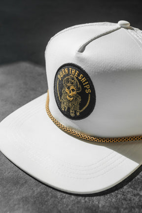 relentless betrayal - burn the ships whiteout snapback flat lay