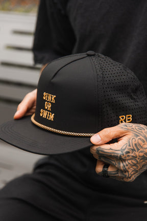 relentless betrayal - sink or swim blackout logo embroidered snapback