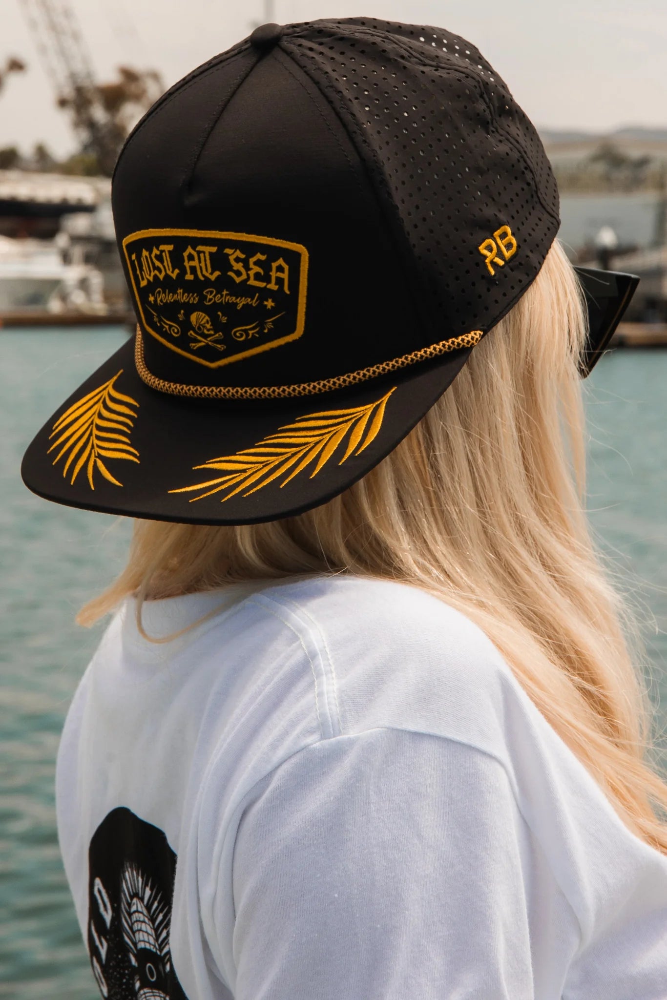 relentless betrayal - lost at sea blackout snapback on women's model