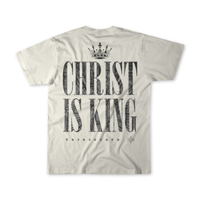 The Christ is King - Ivory T-shirt by 13th features a crown graphic above bold CHRIST IS KING text with THIRTEENTH 13|H below—a premium tee perfect for making a faith-filled statement.