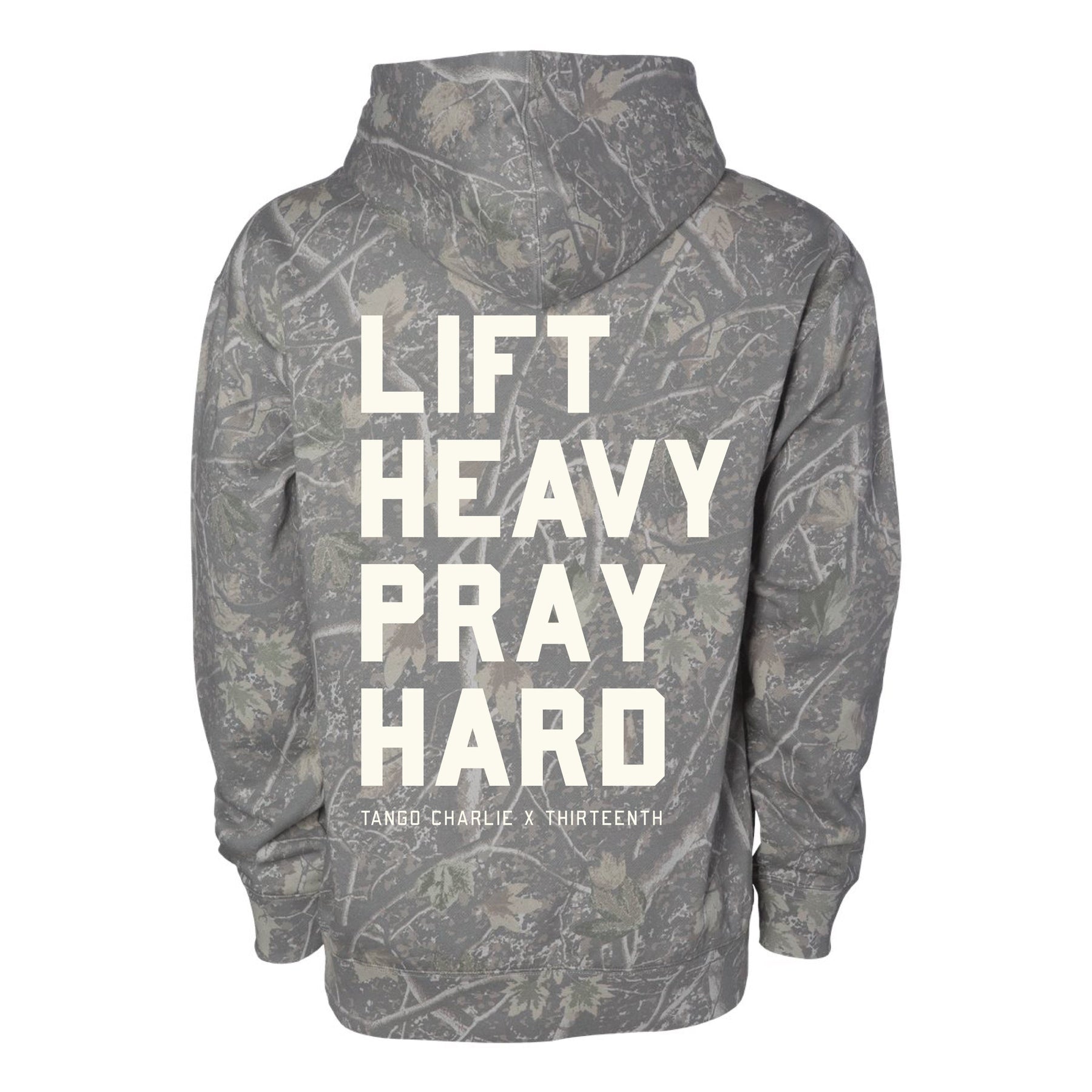 The Lift Heavy. Pray Hard. - Deadwood Camo Hoodie by Tango Charlie Apparel features bold white lettering to inspire spiritual strength in and out of the gym.