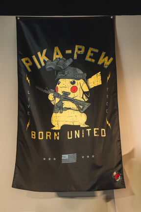 The Pika-Pew Flag by Born United Private Label features a tactical Pikachu in military gear with a rifle, yellow lightning bolts, and a faded American flag. Texts read "PIKA-PEW," "LIVE FREE," and "BORN UNITED"—a must-have for collectors.