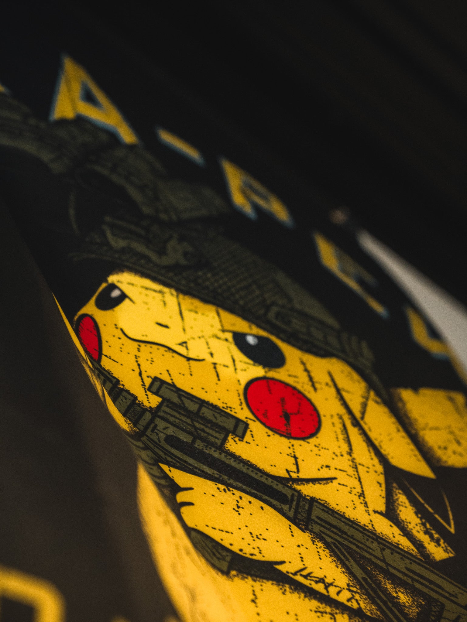 The Pika-Pew Flag by Born United Private Label features a yellow cartoon character with a helmet and rifle, printed on textured fabric with bold graphics—a tactical Pokémon-inspired piece perfect for collectors.