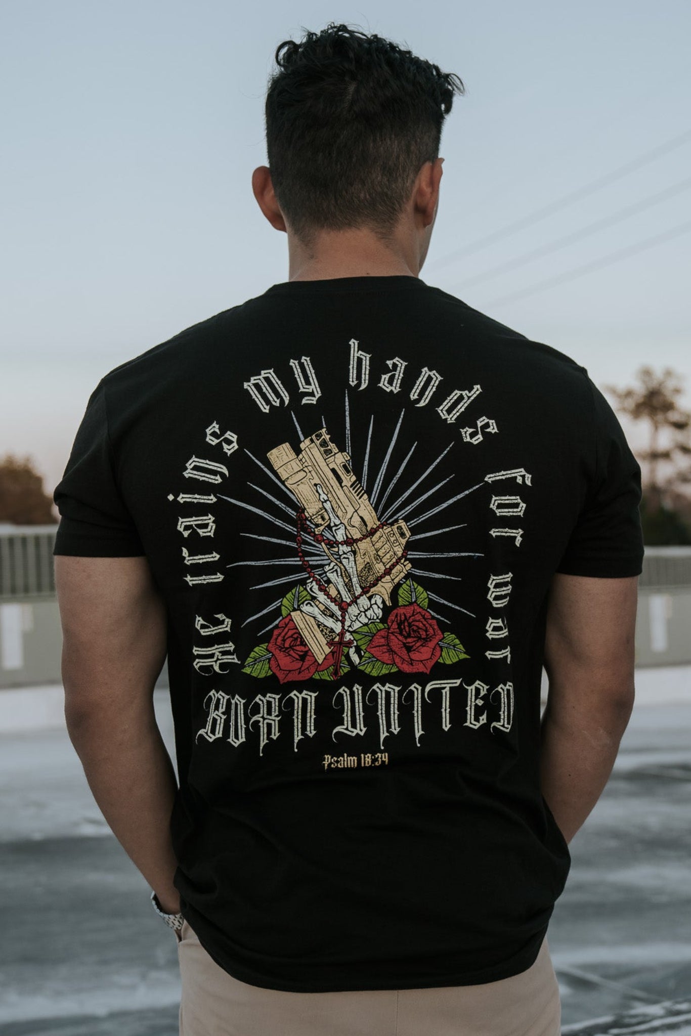 born united - war hands t-shirt back on model