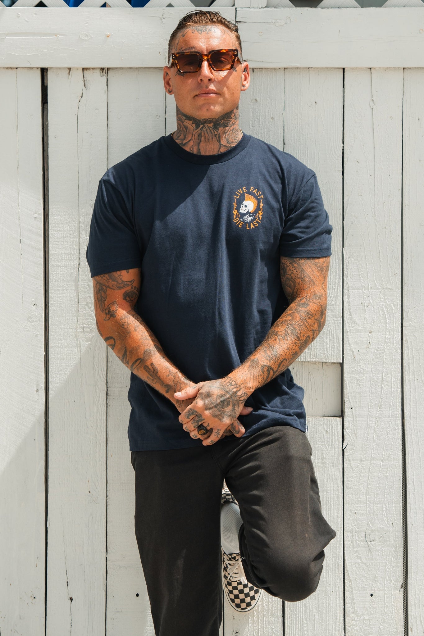 relentless betrayal - live fast die last navy t-shirt on men's model