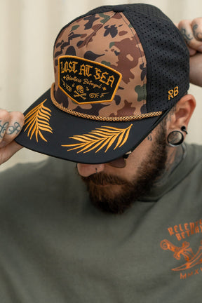 relentless betrayal - lost at sea frog camo gold leaf snapback