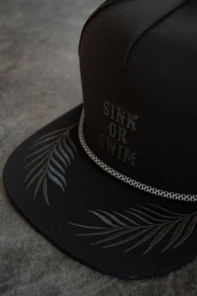 relentless betrayal - sink or swim blackout pvc snapback closeup