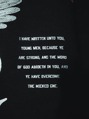 The 13th Overcome Premium Hoodie features white text on black: "I have written unto you, young men, because ye are strong..." (John 2:14), with partial white feather designs on the left.