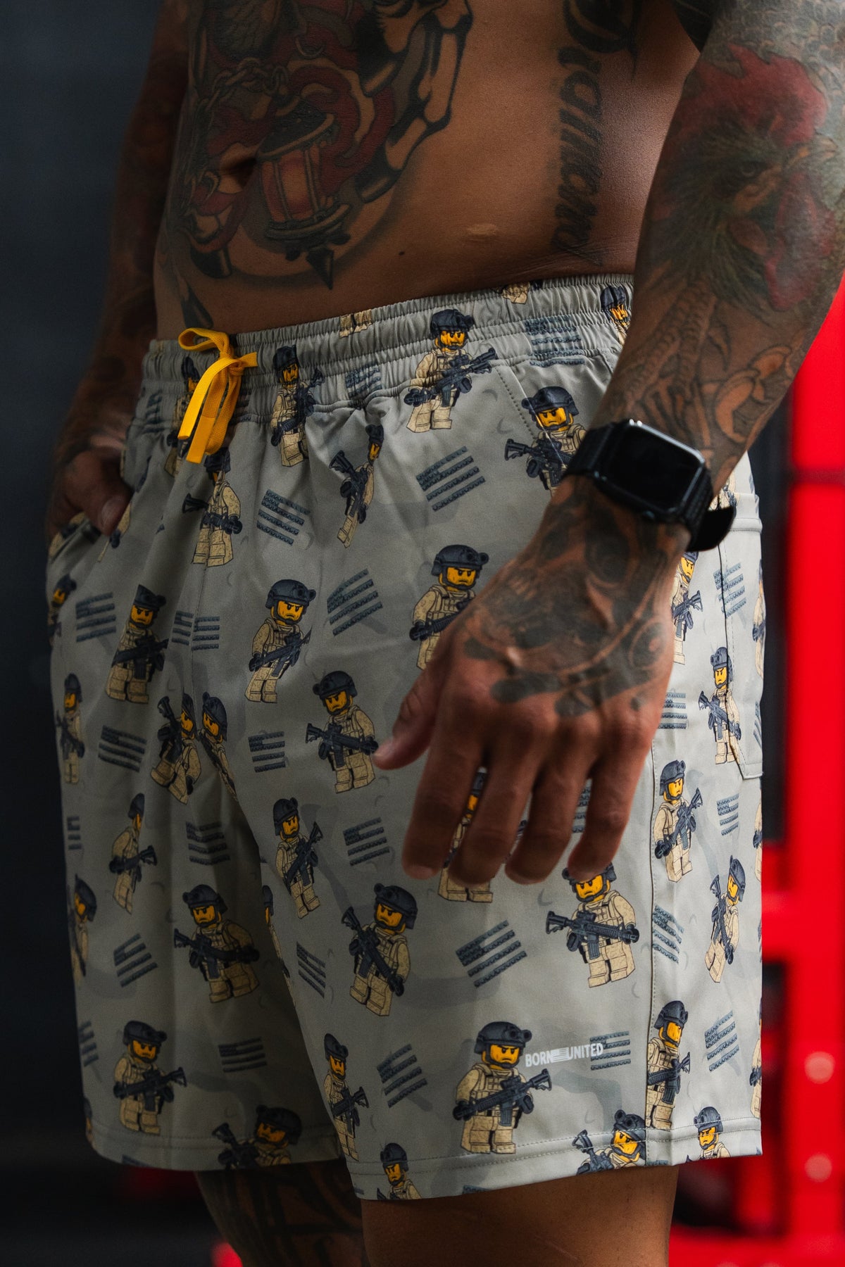 Person wearing patterned shorts with a blurred background