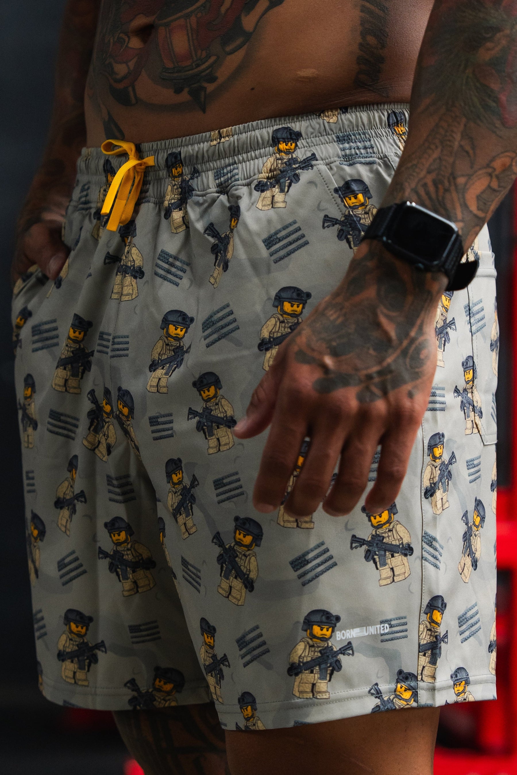 Person wearing patterned shorts with a blurred background