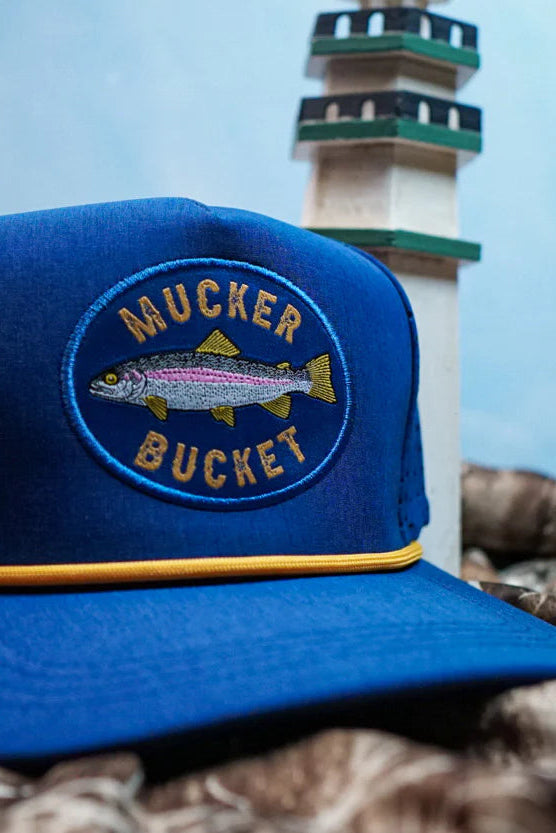 mucker bucket - rainbow trout blue bucket flat lay