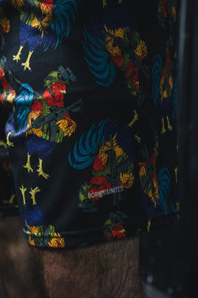 Colorful patterned shorts with a brand logo on a dark background
