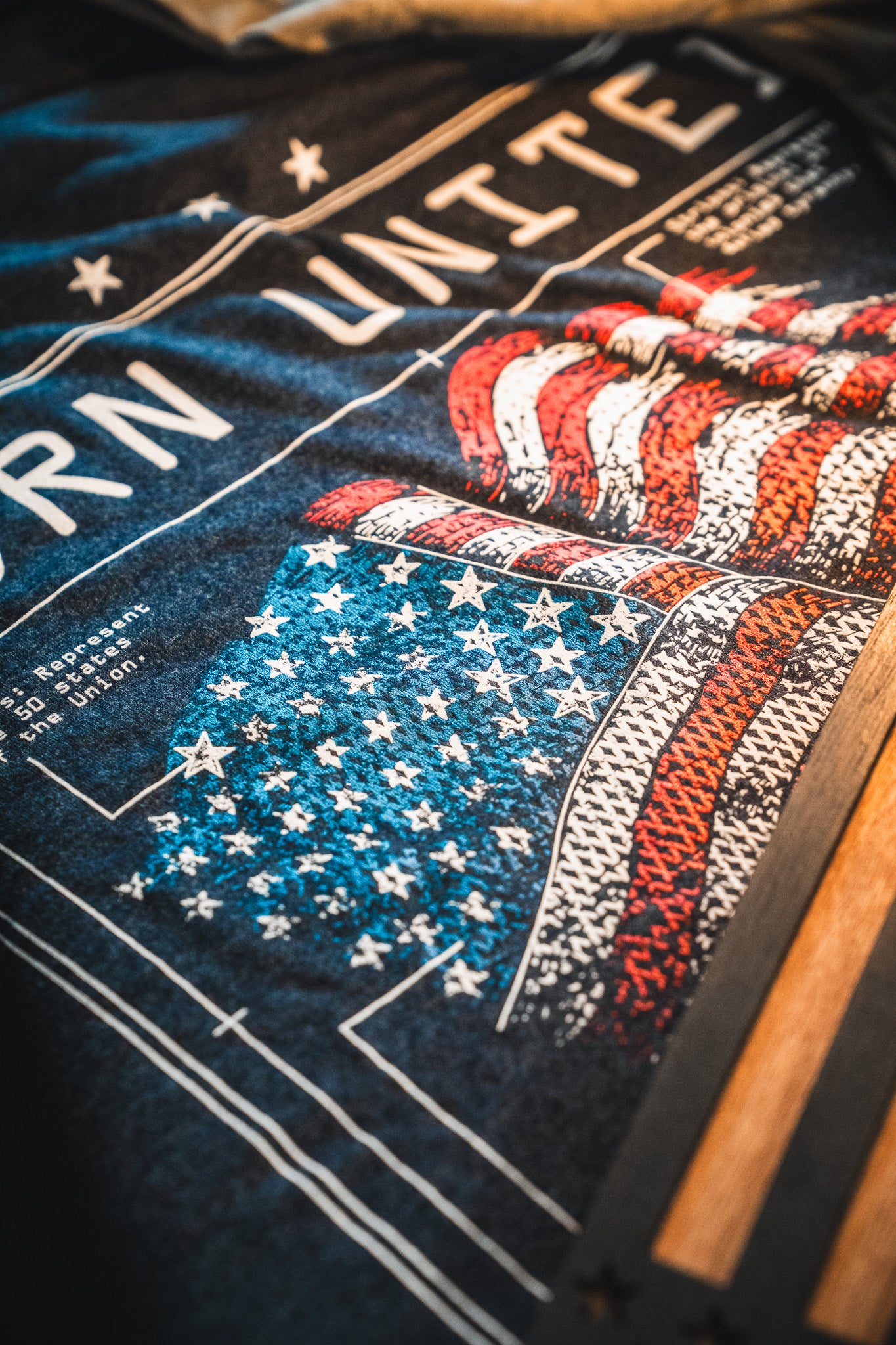 A close-up of the Born United Private Label Limited Edition Tee from the Born United Patriot Box, featuring a stylized American flag—ideal for America's 250th Birthday or your Patriot Box collection.