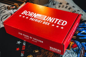 A red Born United Patriot Box by Born United Private Label sits on a surface with Limited Edition Tees for America’s 250th Birthday, featuring white text, stars, an American flag, “250 Years of Freedom,” and a warning about triggering liberals.