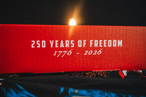 A red Born United Patriot Box by Born United Private Label shows "250 YEARS OF FREEDOM 1776 - 2026" in white letters, lit against a dark background—celebrating America’s 250th Birthday.