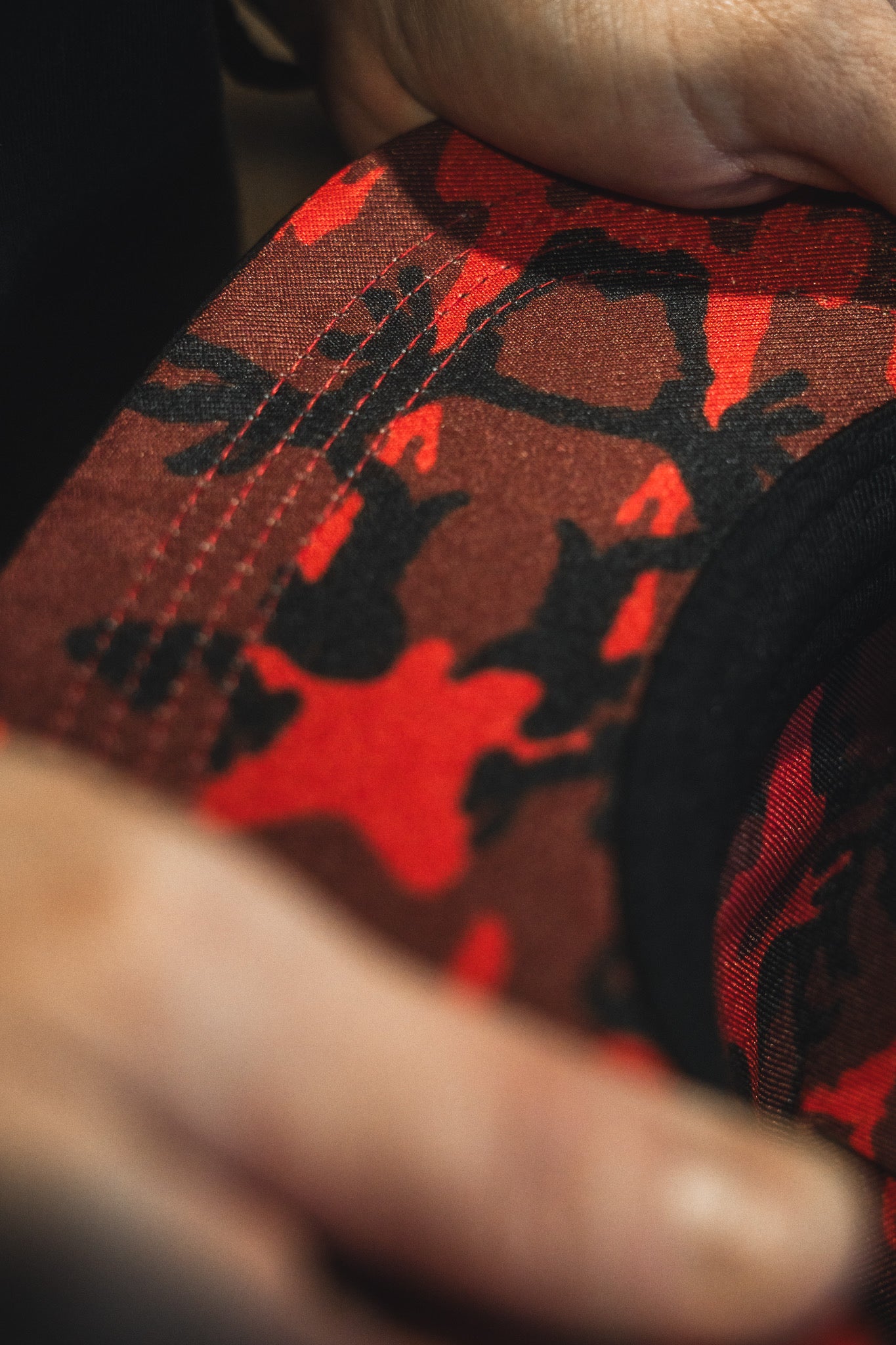 Close-up of a red and black camouflage-patterned fabric.