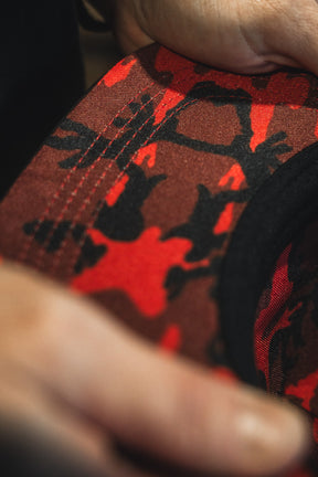 Close-up of a red and black camouflage-patterned fabric.