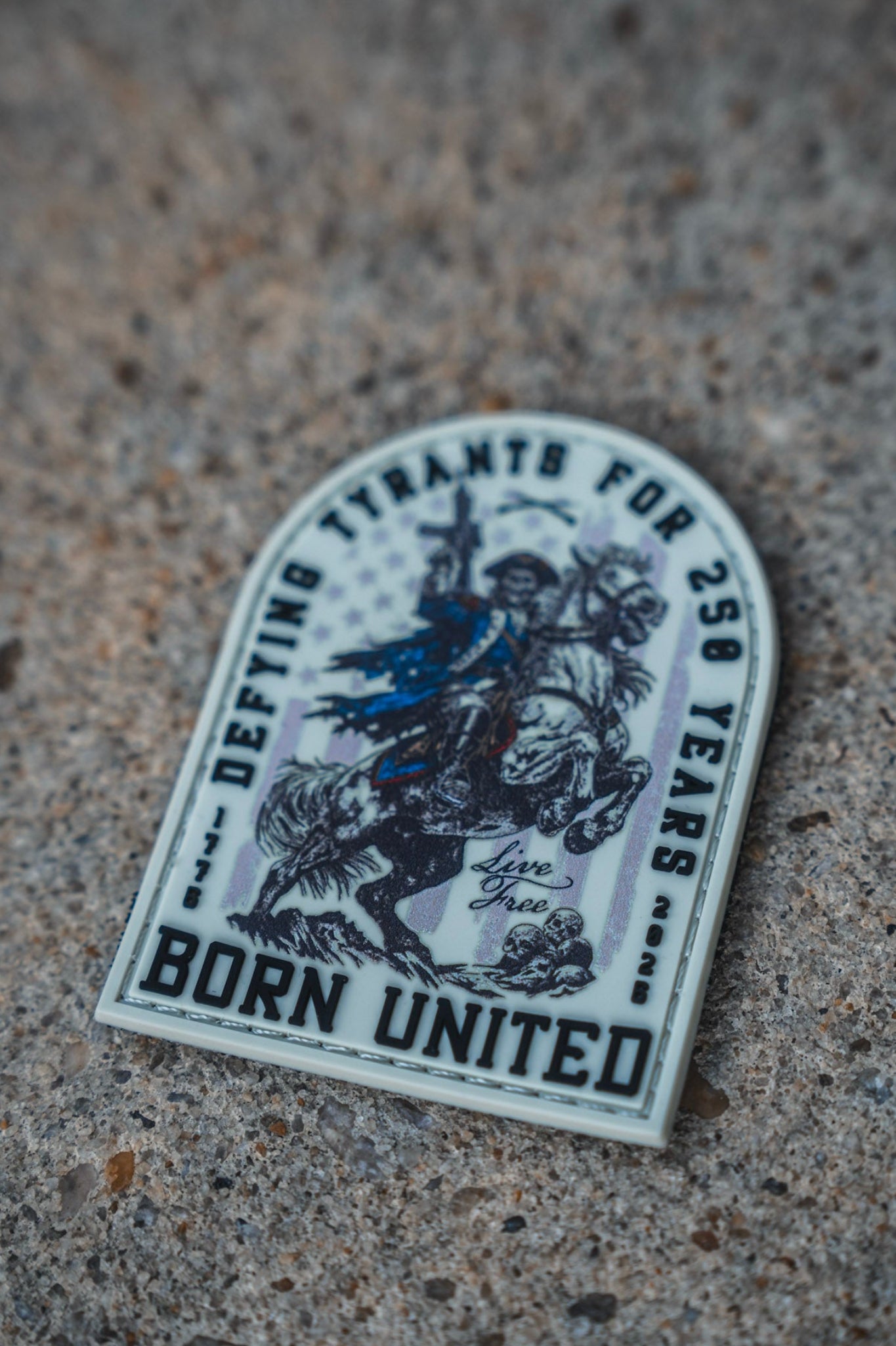 Add to your collection the 250th Anniversary PVC Patch by Born United Private Label—a striking 3" x 3" 3D patch showcasing a mounted soldier and featuring the phrases "DEFYING TYRANTS FOR 250 YEARS" and "BORN UNITED," along with the motivating message "Live Free." Built for durability, this patch comes equipped with Velcro tear-away backing for effortless attachment and removal.
