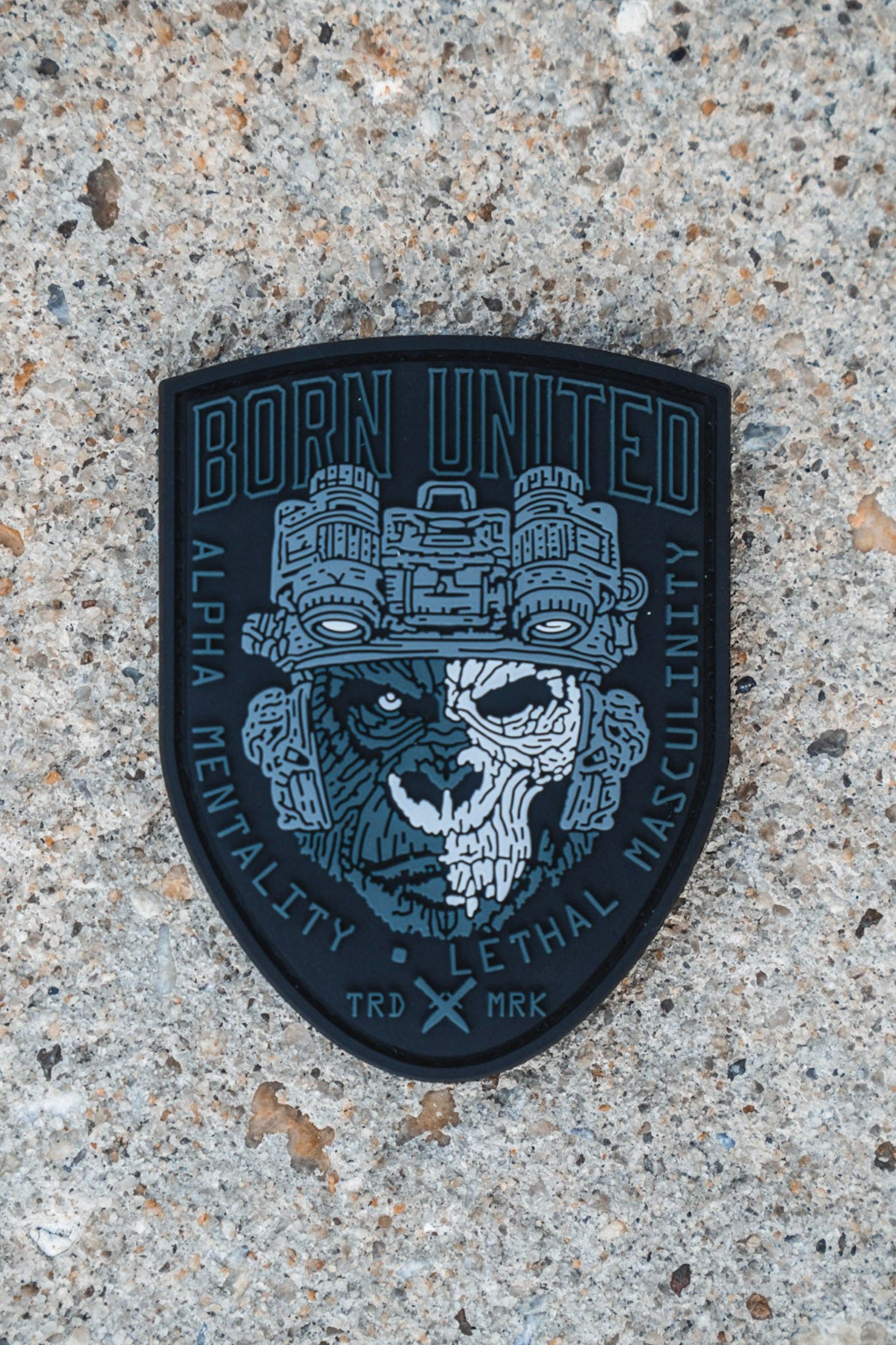 A rugged PVC patch from Born United Private Label, the Alpha Mentality Patch features a skull-faced soldier in night vision goggles and showcases the phrases "Born United," "Alpha Mentality," and "Lethal Masculinity.