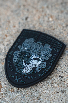 A black Alpha Mentality PVC Patch from Born United Private Label showcases a skull and wolf graphic, boldly featuring the phrases "Alpha Mentality" and "Lethal Masculinity," as well as "Grunt United" alongside a striking night vision goggle design.