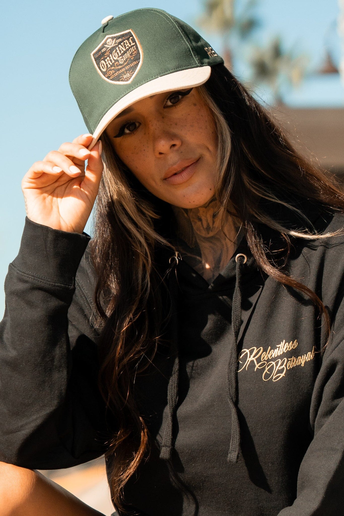 relentless betrayal - og forest green snapback on women's model