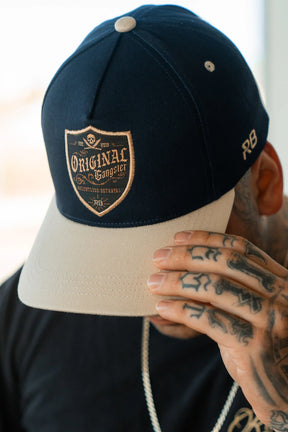 relentless betrayal - og navy two toned snapback hat on model