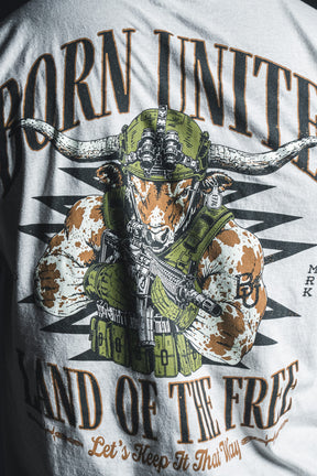 Introducing the “Freedom Frontier” graphic T-shirt by Born United Private Label—a bold statement piece featuring an armored longhorn wielding a rifle and the empowering text, “BORN UNITED, LAND OF THE FREE, Let’s Keep It That Way.” Celebrate freedom and American values in style.
