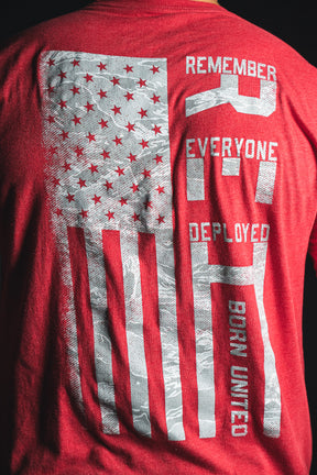 Back of a red Born United Private Label RFV2 shirt featuring a stylized American flag and the text “Remember Everyone Deployed V2 Born United” in white letters.