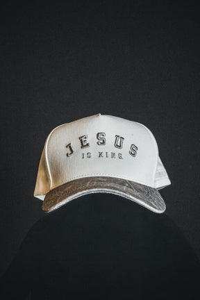 Introducing the Jesus is King - Ivory and Deadwood Camo Snapback by Born United Private Label, featuring bold “JESUS IS KING” embroidery on the front. Set against a dark background, this eye-catching cap is ideal for anyone wanting to make a powerful statement of faith.