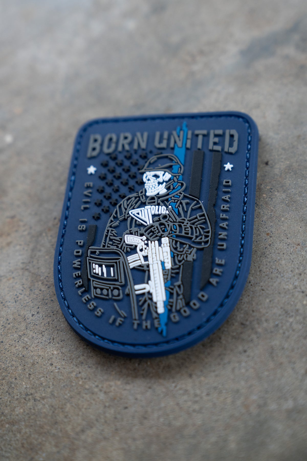 The Good Are Unafraid PVC Patch from Born United Private Label shows a skull-faced soldier holding a gun over an American flag, with BORN UNITED above and EVIL IS POWERLESS IF THE GOOD ARE UNAFRAID around the edge.