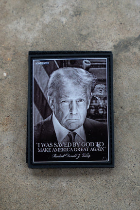 Small framed picture of a person with text on a textured surface