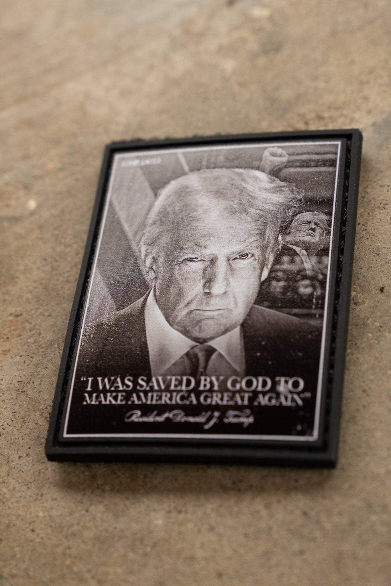 Memorabilia with a black and white photo of a person and text on a textured surface