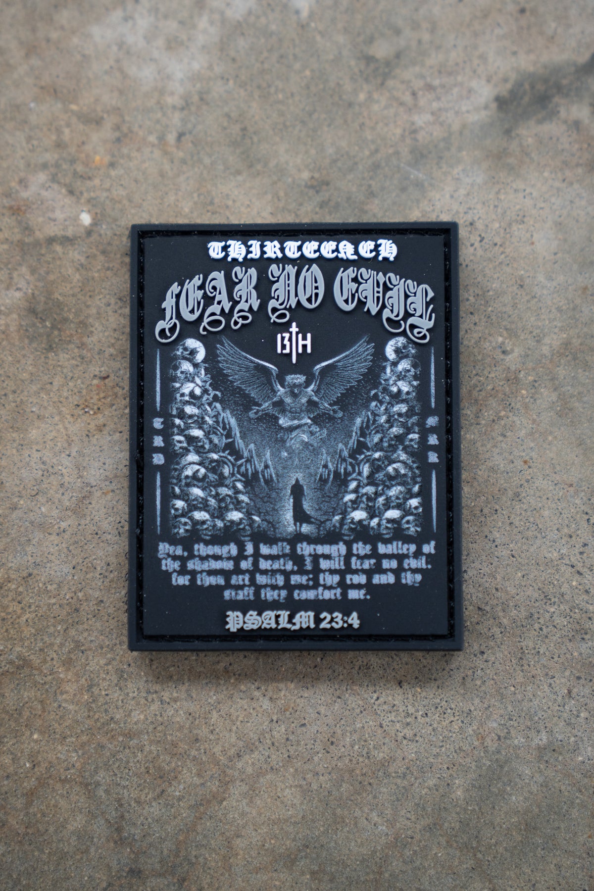 The Fear No Evil PVC Patch by 13th features an eagle, skulls, clouds, gothic text reading FEAR NO EVIL and 13th, plus a quote from Psalm 23:4 about walking through the valley of the shadow of death on a black stone-like surface.