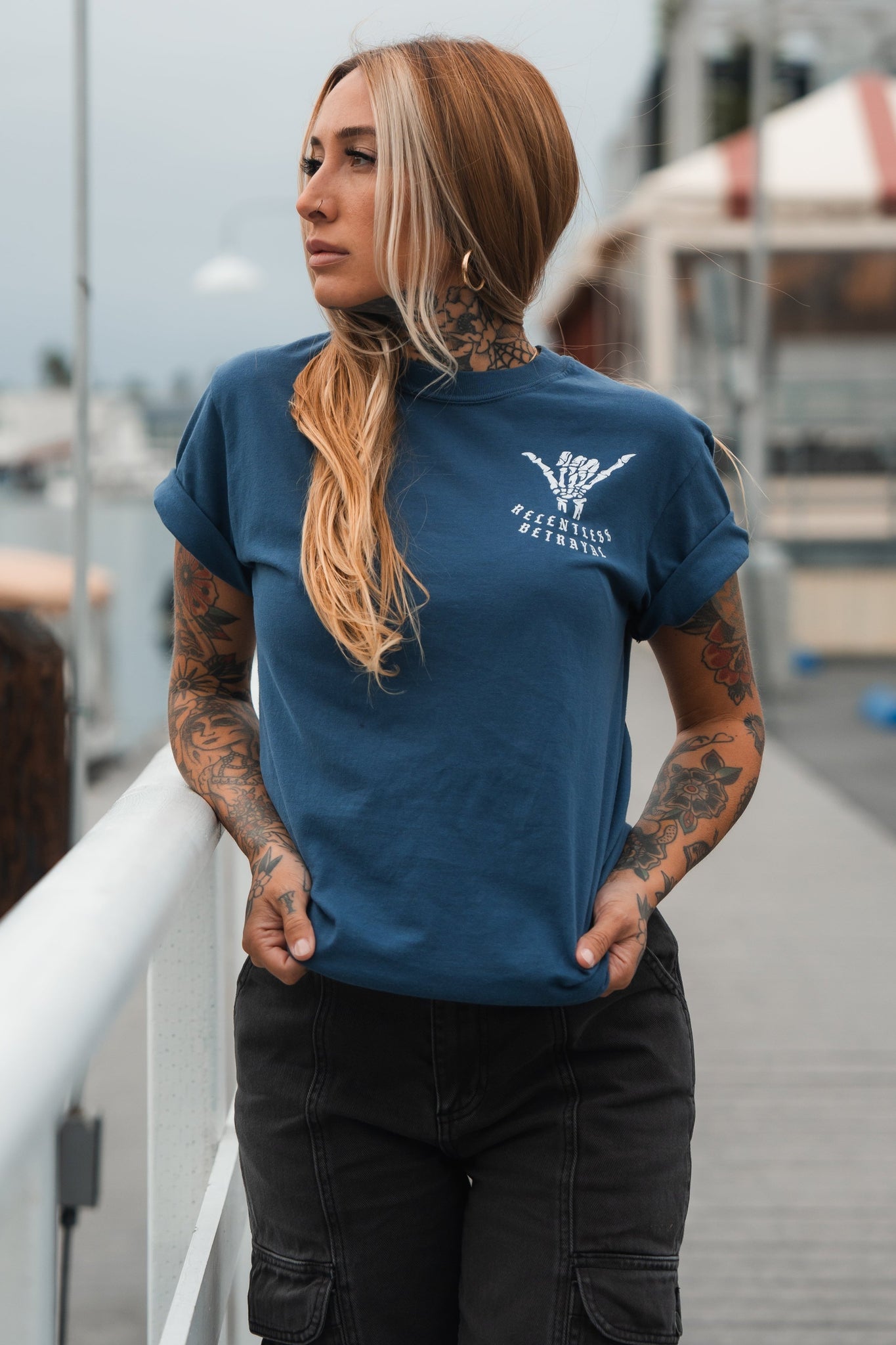 relentless betrayal - sink or swim premium slate tee shirt on women's model