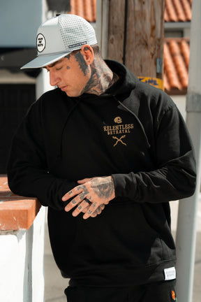 relentless betrayal - loose lips sink ships gold foil hoodie on men's model