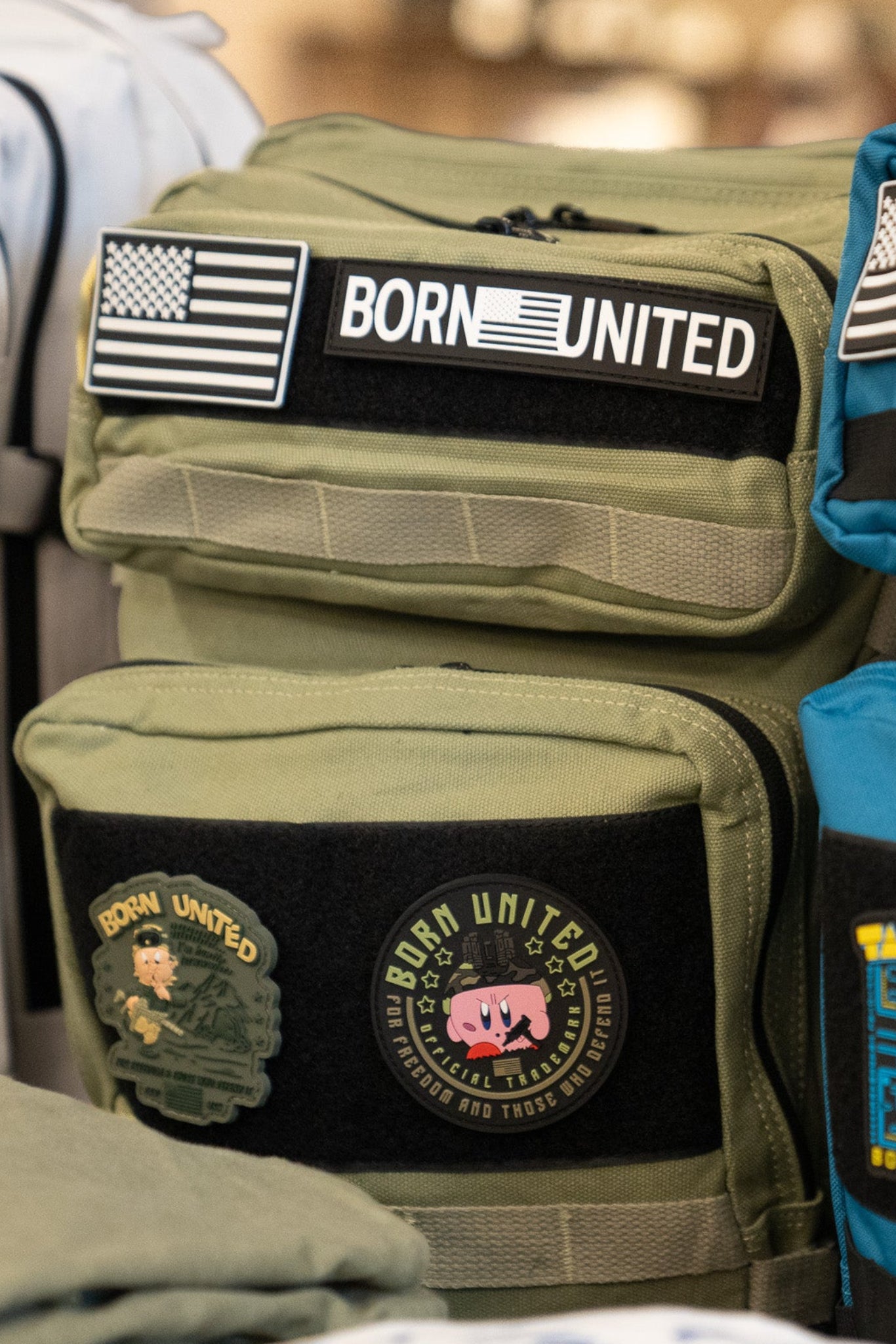 born united - poppin' off pvc patch on backpack