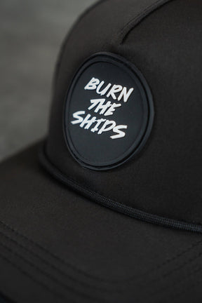 relentless betrayal - burn the ships black pvc snapback closeup