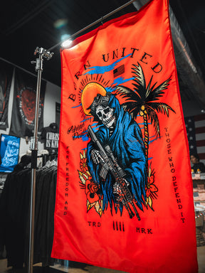 The Always Deadly Flag by Born United Private Label features a red background, a skeleton in a blue hooded robe with a rifle, palm trees, sun, and the text "Born United, For Freedom and Those Who Defend It" plus other small phrases.