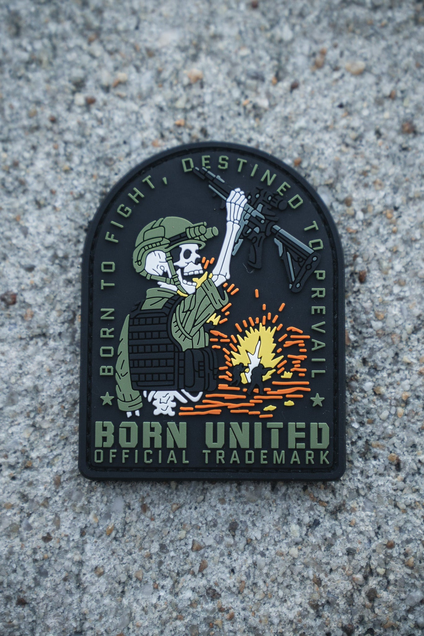 The Destined to Prevail PVC Patch by Born United Private Label shows a skeleton soldier in tactical gear with a rifle over an explosion, featuring the text "Born to fight, destined to prevail" and Born United Official Trademark on a concrete background.