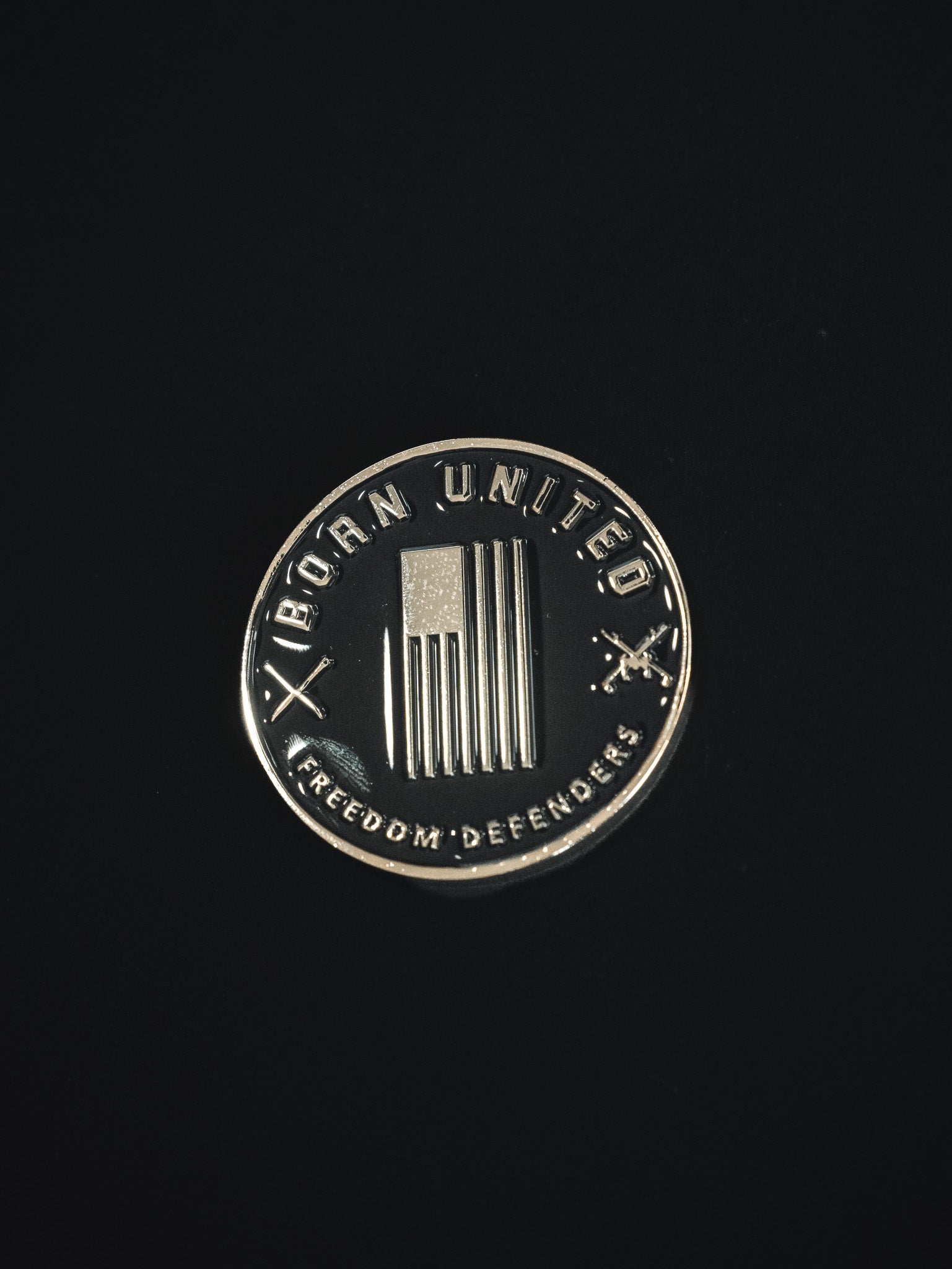 born united = poppin' off challenge coin back