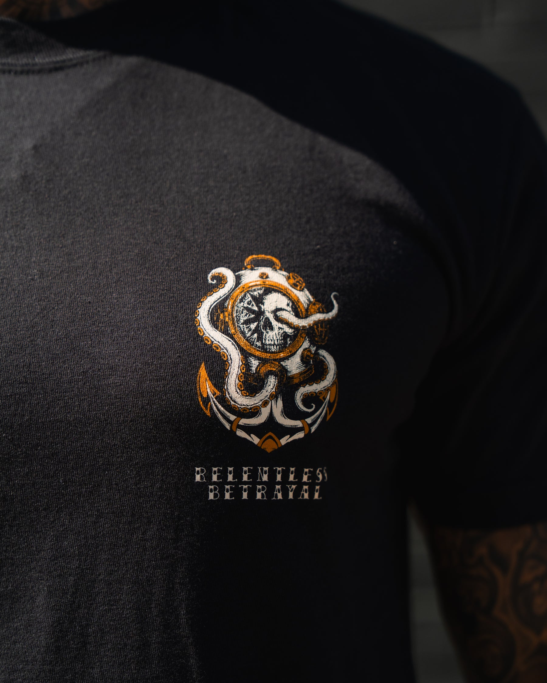 Close-up of the No Safe Harbor Premium T-Shirt by Relentless Betrayal, featuring an octopus and clock graphic—ideal for fans of nautical skull designs.