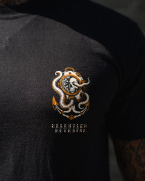 Close-up of the No Safe Harbor Premium T-Shirt by Relentless Betrayal, featuring an octopus and clock graphic—ideal for fans of nautical skull designs.