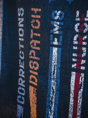 The American Heroes Jacquard Blanket by Born United Private Label features woven vertical stripes and the words CORRECTIONS (blue), DISPATCH (orange), EMS (blue), and NURSE (red) to honor emergency services.