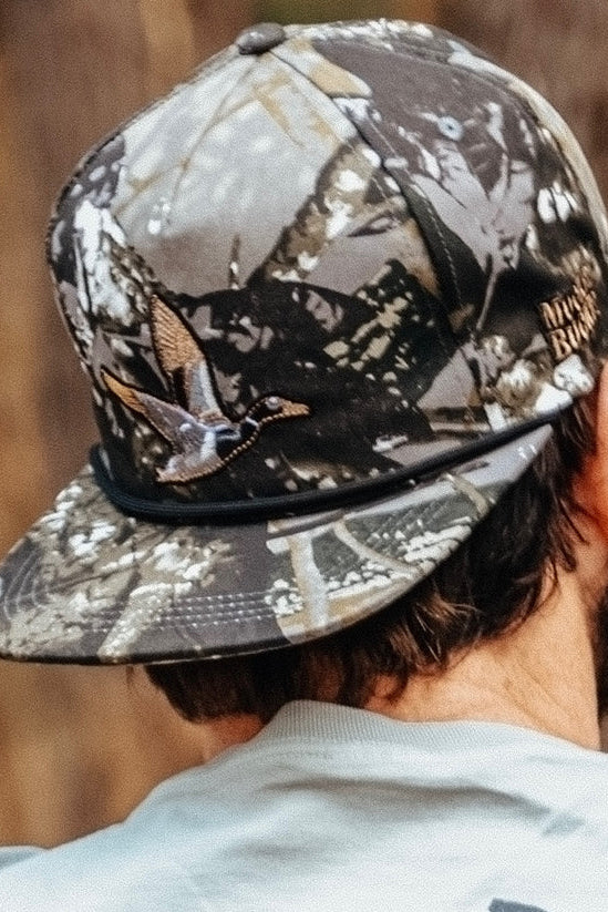 mucker bucket - treestand oak camo duck bucket hat on model