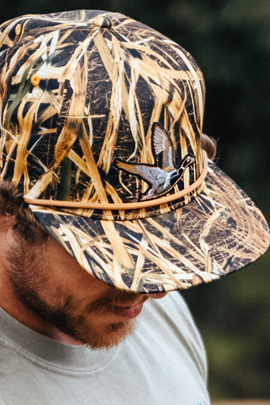 mucker bucket - straw grass camo duck snapback hat on model