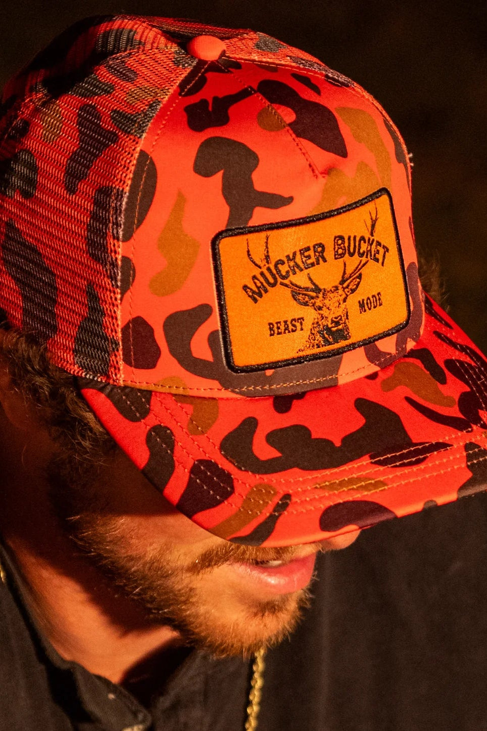 mucker bucket - "beast mode" orange camo trucker hat side